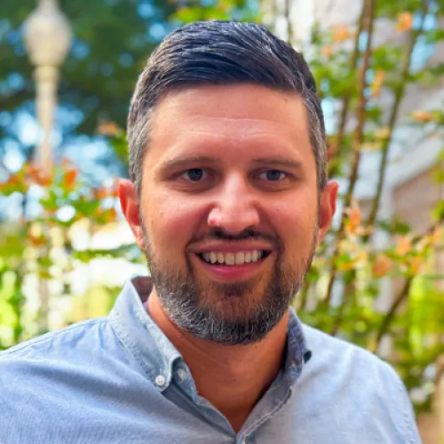 Nic Dahlberg smiling in an outdoor setting