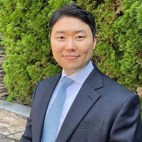 Ted Sohn smiling in an outdoor setting