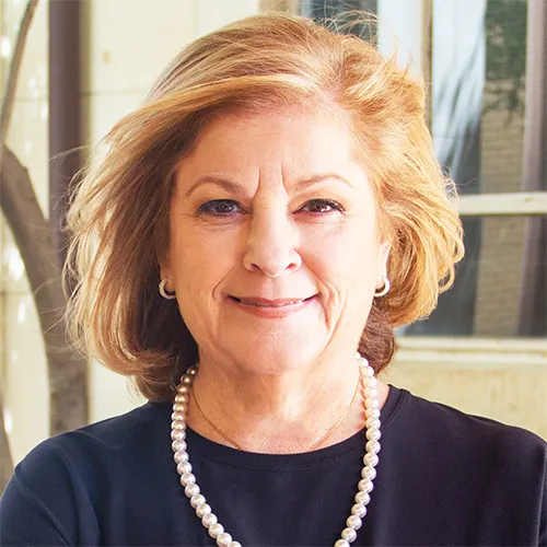 Dr. Diane Ginsburg smiling in an outdoor setting