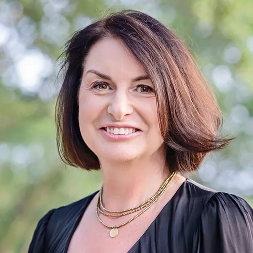 Tina Mowday smiling in an outdoor setting