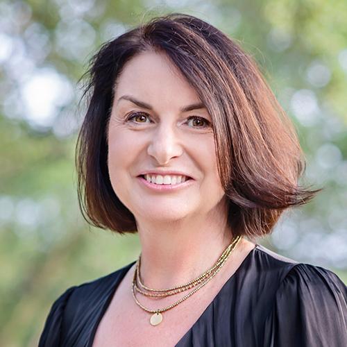 Tina Mowday smiling in an outdoor setting