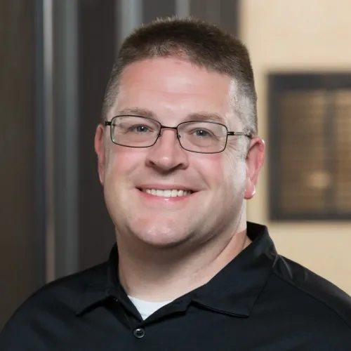 Brian Becker smiling in the Pharmacy building