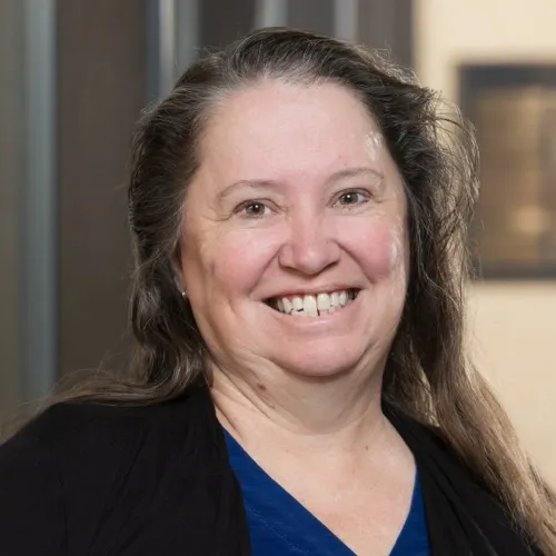 Sharon DeMorrow smiling in the Pharmacy building
