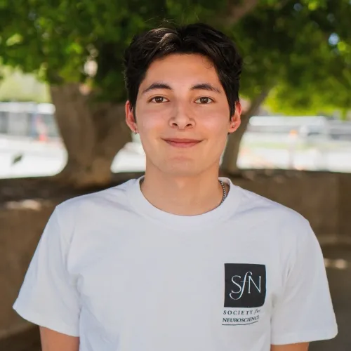 Hector Leon smiling in an outdoor setting