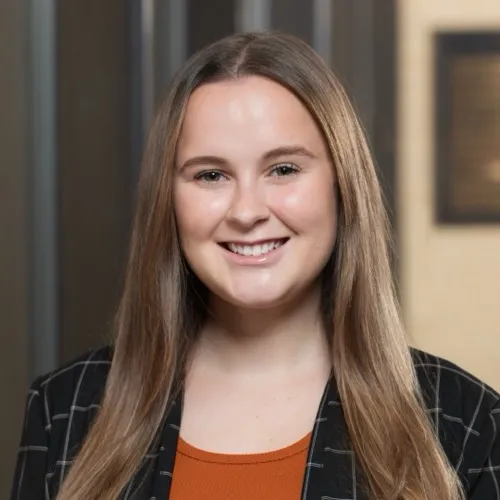 Abby Moore smiling in the Pharmacy building