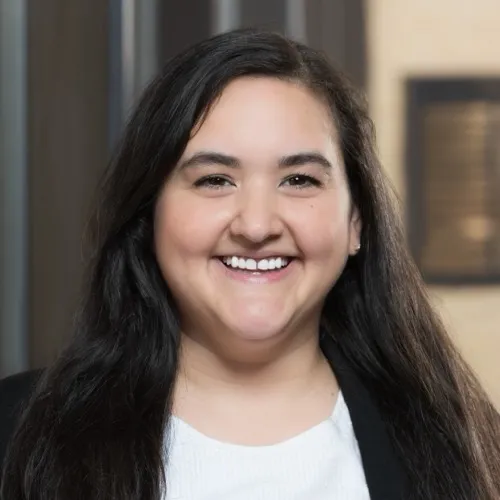 Morgan Stewart smiling in the Pharmacy building