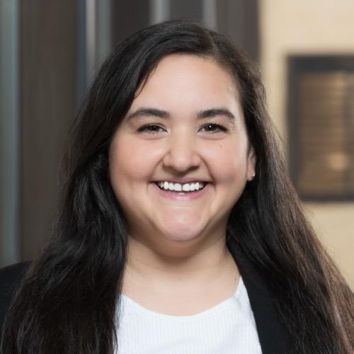 Morgan Stewart smiling in the Pharmacy building