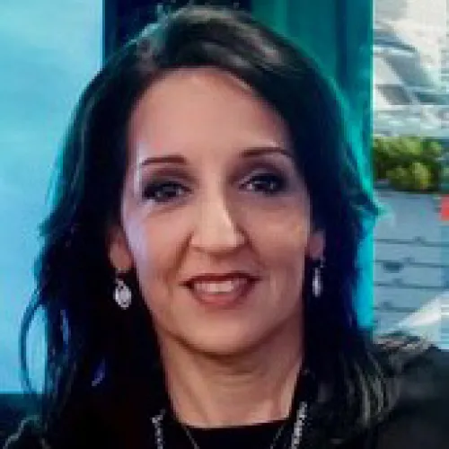 Donna Montemayor smiling in an indoor setting