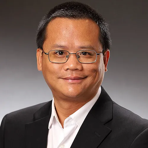 Dr. Yongchao Su smiling and wearing a sportcoat