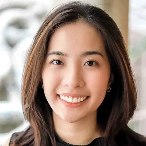 Anh Le smiling and wearing a black top