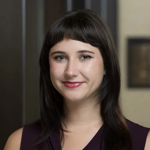 A woman smiling.