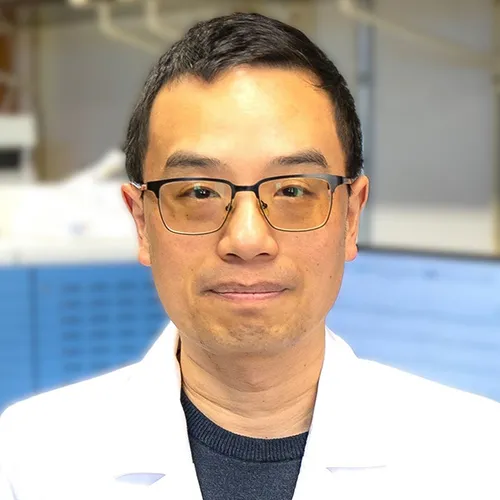 Dr. Jie Li wearing a white labcoat