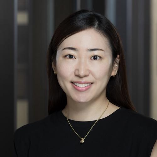 Dr. Hyeun Ah Kang smiling in an indoor setting