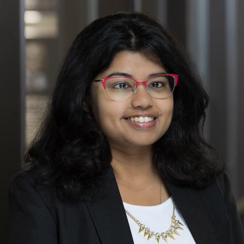 Dr. Deepika Rao smiling in an indoor setting