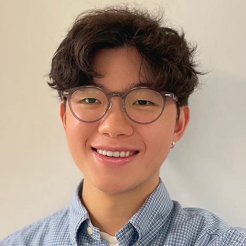 Siang-Hao Cheng smiling and wearing a checkered shirt