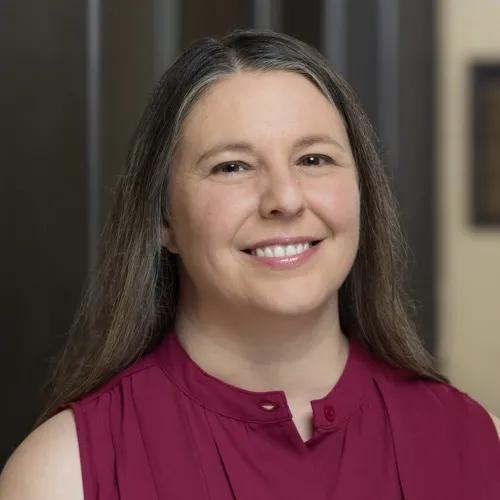 A woman smiling.