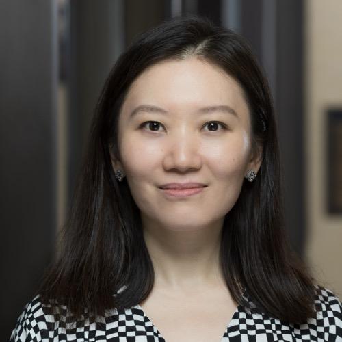 Jiebing Wen smiling in an indoor setting