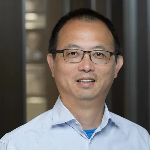 Dr. Feng Zhang smiling in an indoor setting