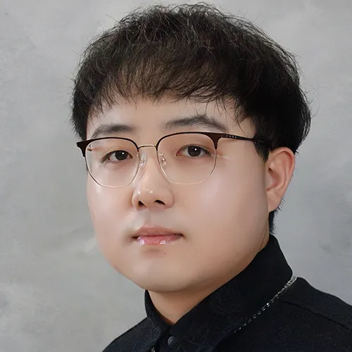 Yubo Wang wearing glasses and a black shirt