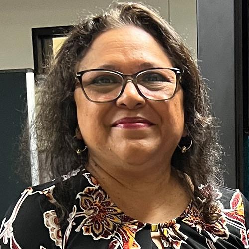 Carmen Juarez smiling in an indoor setting
