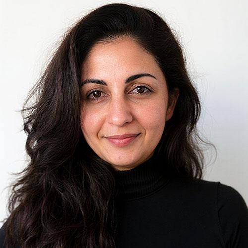Mona Keshavarzi smiling and wearing a black turtleneck