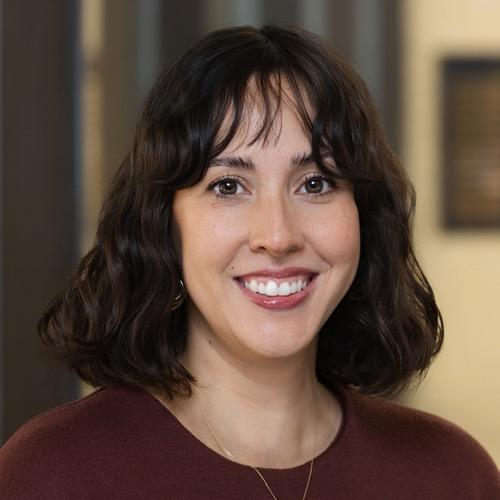 A woman smiling.