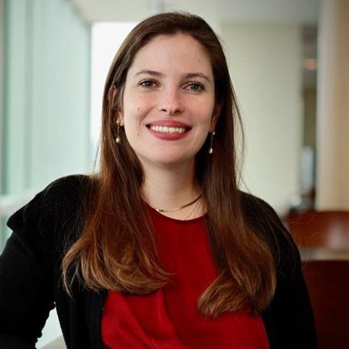 Dr. Juliana Yerneni smiling in an indoor setting