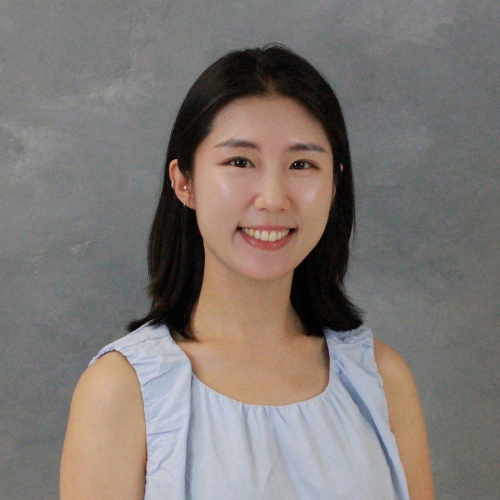 Yeijin Kim smiling in front of a gray background