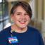 Kelsey Bailey smiling and wearing an H-E-B nametag