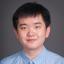 Junjie Gai smiling and wearing a blue shirt