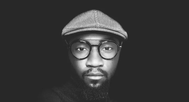 Russell Boyd wearing a hat and glasses.