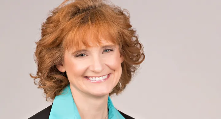 Dr. Maria Croyle smiling in headshot photo
