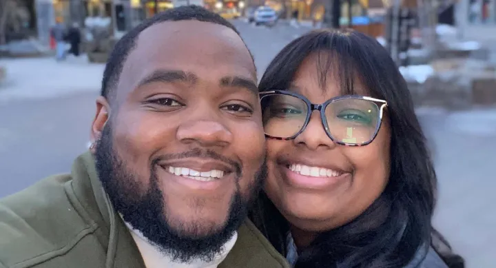 A man and a woman smiling.