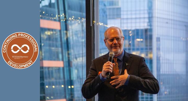 Dr. Glen Baumgart speaking at a lectern in front of windows with views of Austin skyscrapers and seal for Continuing Professional Development conference with infinity symbol and shield logo for Texas Pharmacy with text, "The University of Texas at Austin College of Pharmacy"