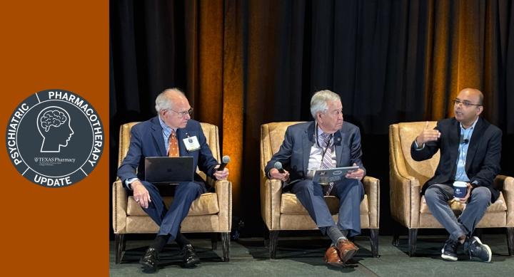 Drs. Saklad, Crismon, and Jha seated on a stage and having a discussion with seal for Psychiatric Pharmacotherapy Update conference, brain icon, and Texas Pharmacy shield logo for The University of Texas at Austin College of Pharmacy.