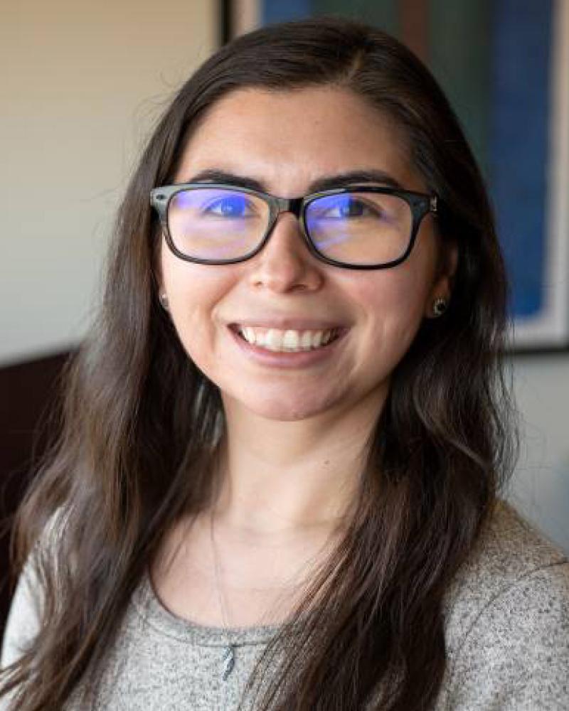 Erica Torres smiling in an indoor setting