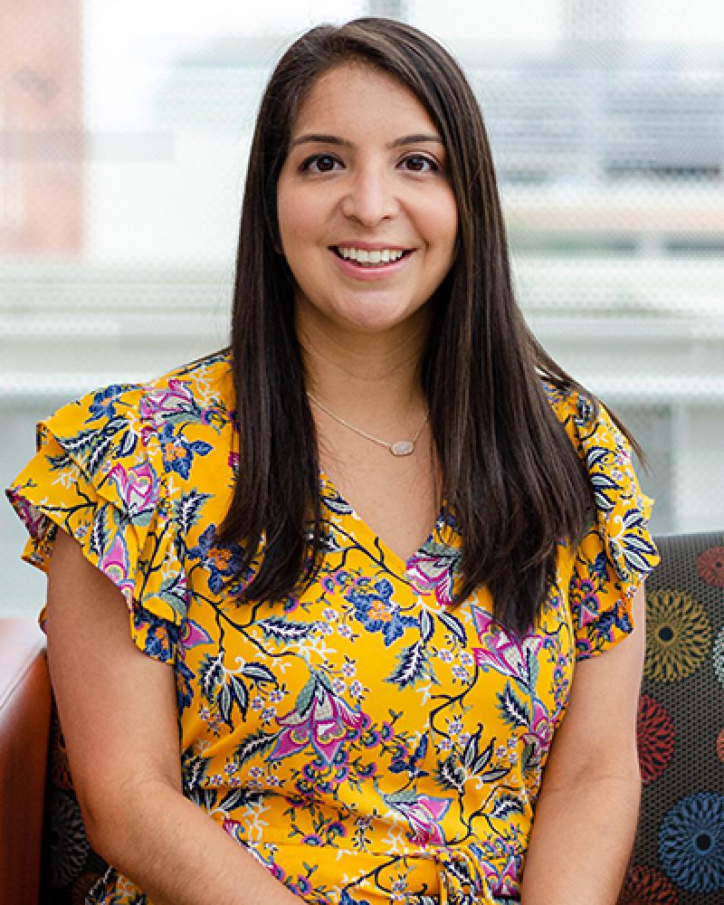 Dr. Lauren Lozano smiling in front of a window
