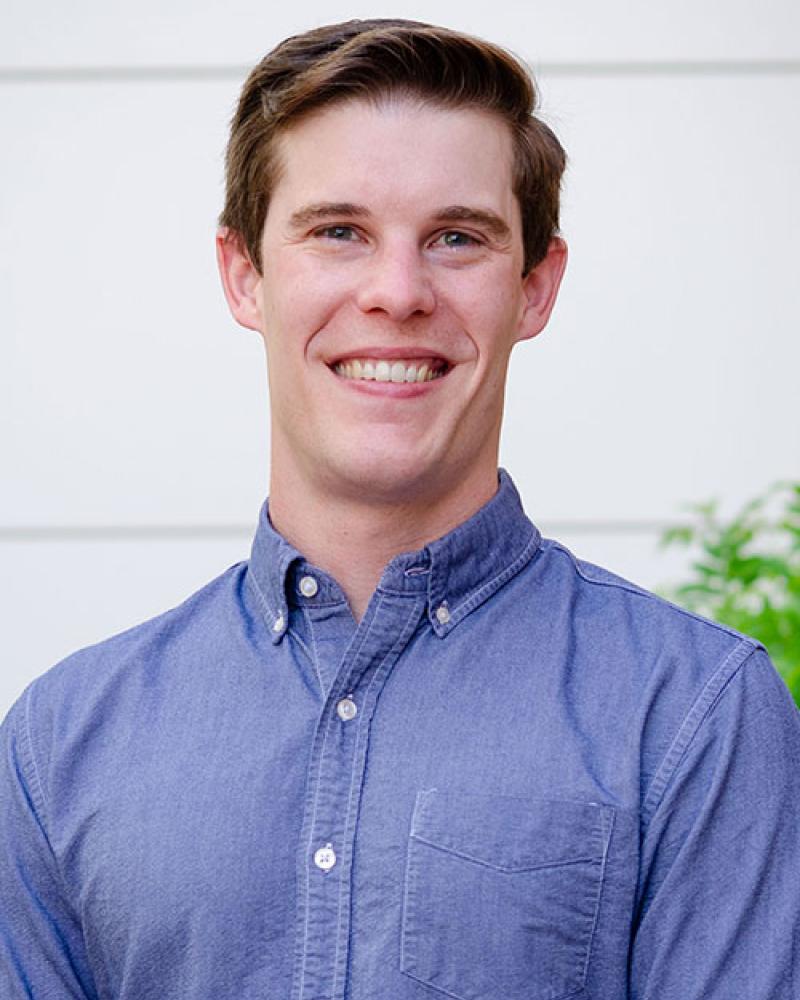 Dr. Mac Whaley smiling in an outdoor setting