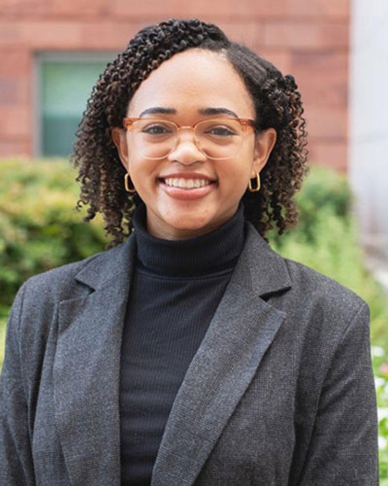 Dr. Paige Gilchrist smiling in an outdoor setting