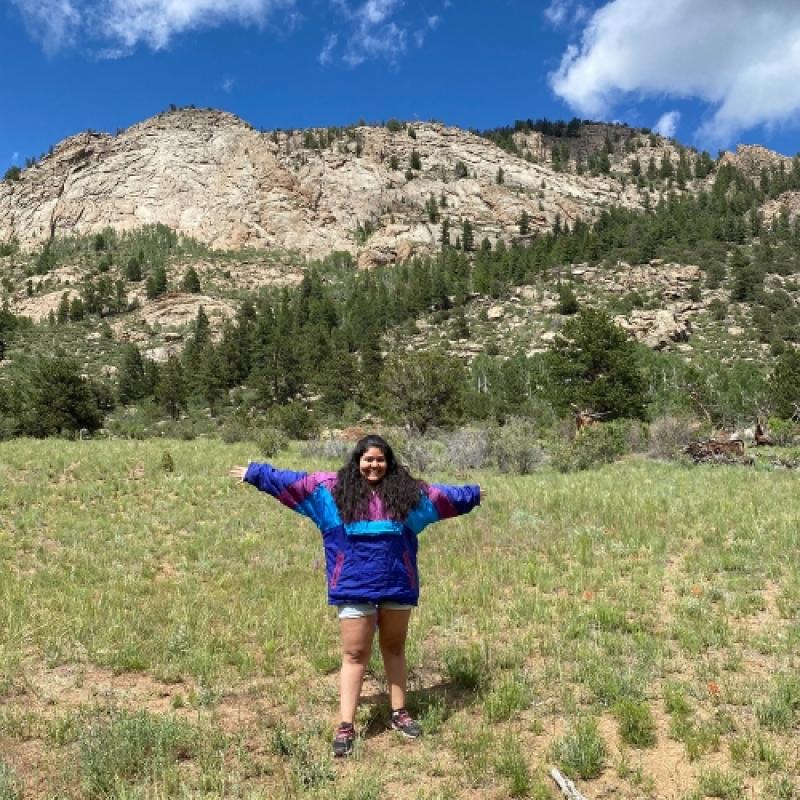 Anisah Aguilar standing in front of a mountain