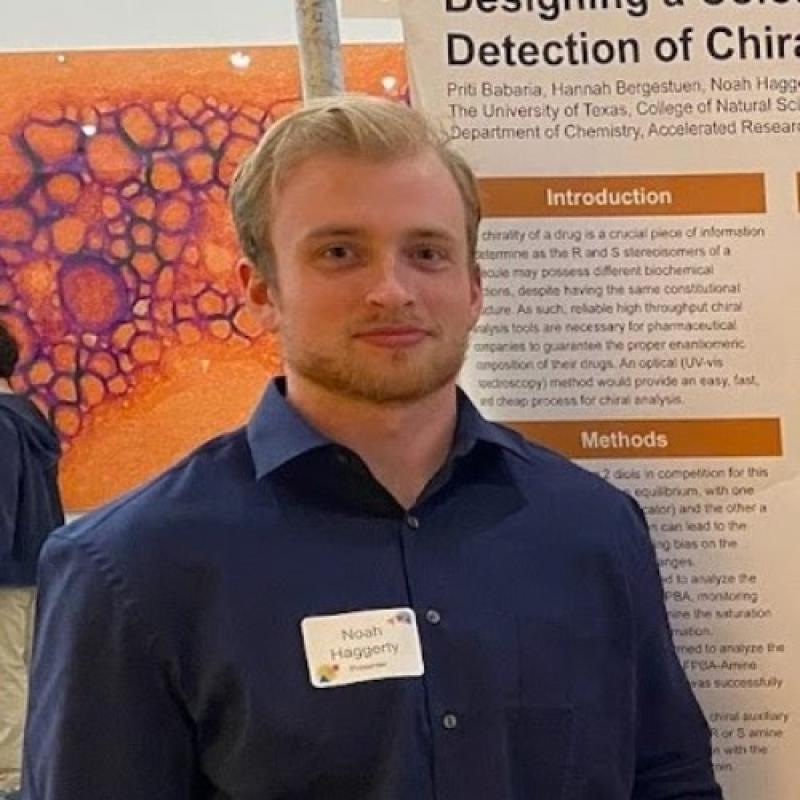 Noah Haggerty standing in front of research poster