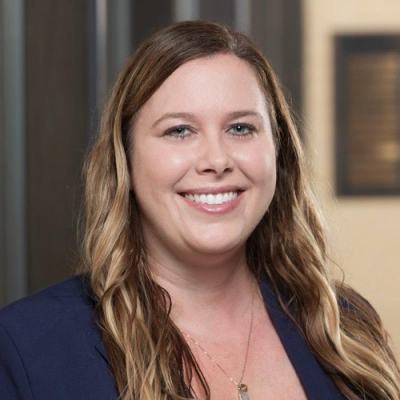 Brynn Huysman smiling in the Pharmacy building