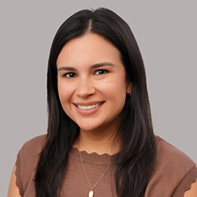 Heather Alfaro smiling in an indoor setting