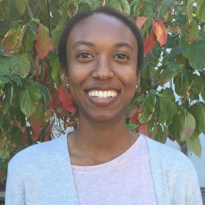 Jada Walker smiling in front of a tree